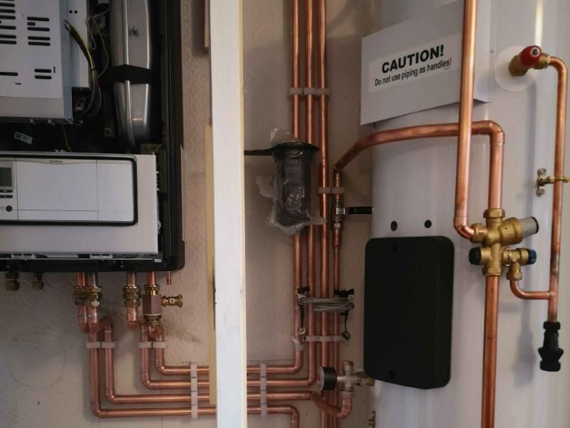 Hot water cylinder with brass valves and copper pipework